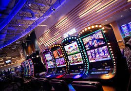 Filipino player spinning online slots on a mobile phone at home